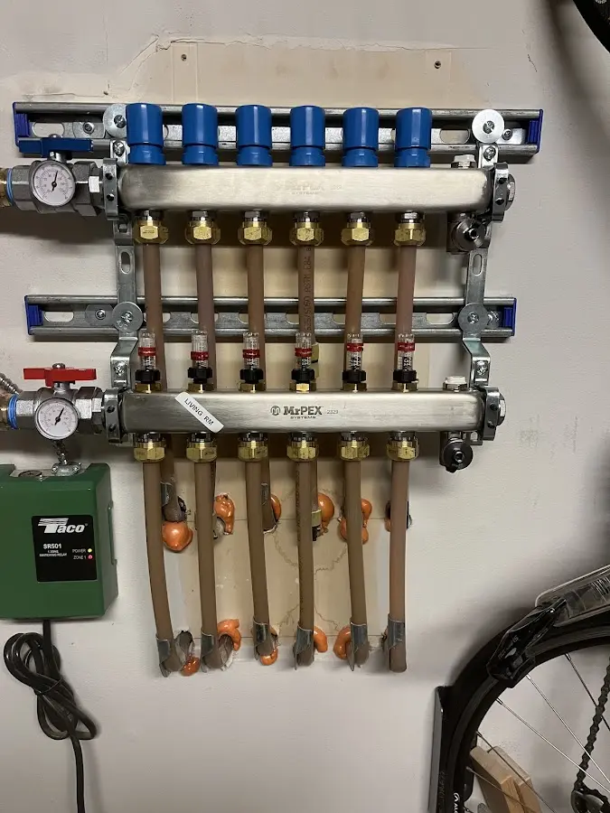 Plumber performing Water Heater Repair at a residential property in Asheville